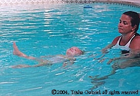 Child floating on back